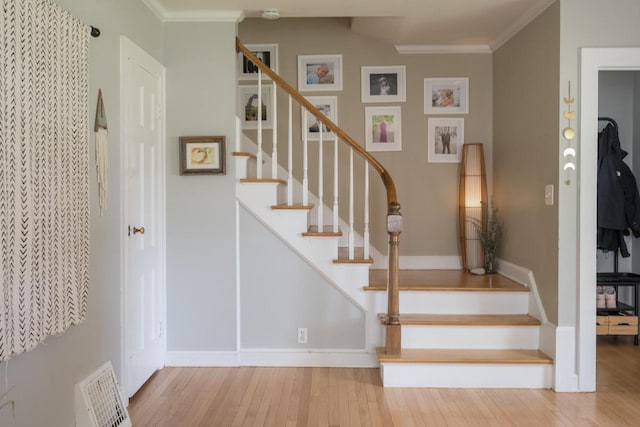 4781 N Idlewild Ave, Whitefish Bay, WI 53211 - stairway with wood finished floors, crown molding, and baseboards