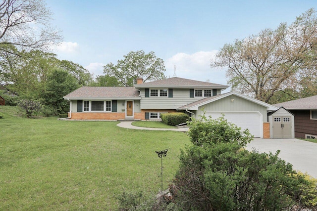 620 S Greenfield Ave, Waukesha, WI 53186 - split level home featuring an attached garage, driveway, brick siding, a chimney, and a front lawn