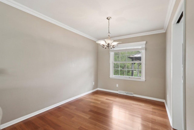 620 S Greenfield Ave, Waukesha, WI 53186 - spare room with a chandelier, wood finished floors, crown molding, and baseboards