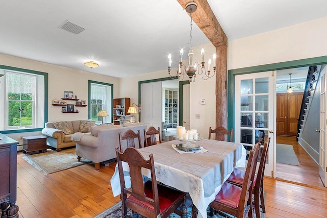 4105 Lime Kiln Rd, Green Bay, WI 54311 - dining room featuring light wood-style floors, a chandelier, and beamed ceiling