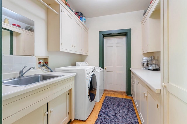 4105 Lime Kiln Rd, Green Bay, WI 54311 - laundry room featuring cabinet space, washer and dryer, and light wood-style flooring