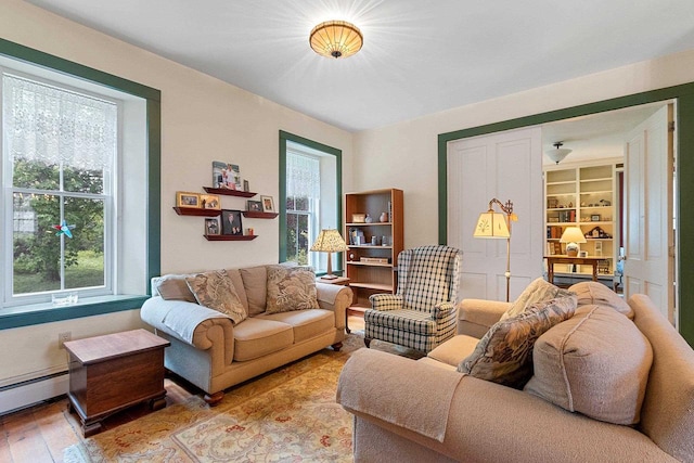 4105 Lime Kiln Rd, Green Bay, WI 54311 - living area with wood finished floors and baseboard heating
