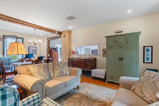 4105 Lime Kiln Rd, Green Bay, WI 54311 - living area featuring a chandelier, light wood-style flooring, beam ceiling, and recessed lighting