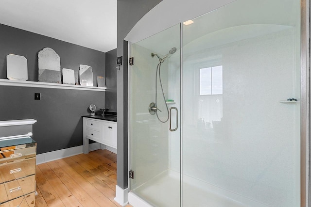 4105 Lime Kiln Rd, Green Bay, WI 54311 - bathroom with hardwood / wood-style flooring, a stall shower, and vanity