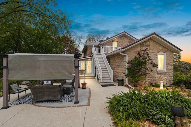 4105 Lime Kiln Rd, Green Bay, WI 54311 - view of side of home featuring stone siding, an outdoor hangout area, a patio, and stairs