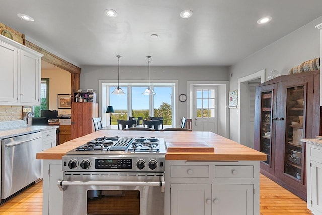 4105 Lime Kiln Rd, Green Bay, WI 54311 - kitchen featuring stainless steel appliances, light wood-style floors, wooden counters, white cabinets, and recessed lighting