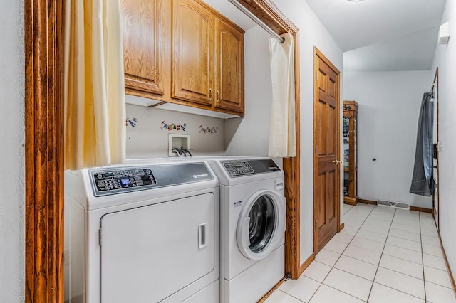 223 Willow Creek Rd, Rosendale, WI 54974 - laundry room with cabinet space, washer and dryer, and light tile patterned flooring