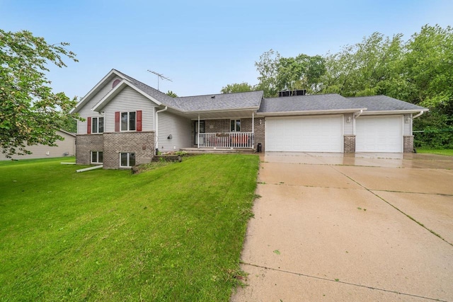 223 Willow Creek Rd, Rosendale, WI 54974 - view of front of property with brick siding, a garage, driveway, and a front yard
