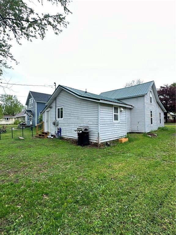 1010 Fillmore St, Black River Falls, WI 54615 - rear view of house with a yard