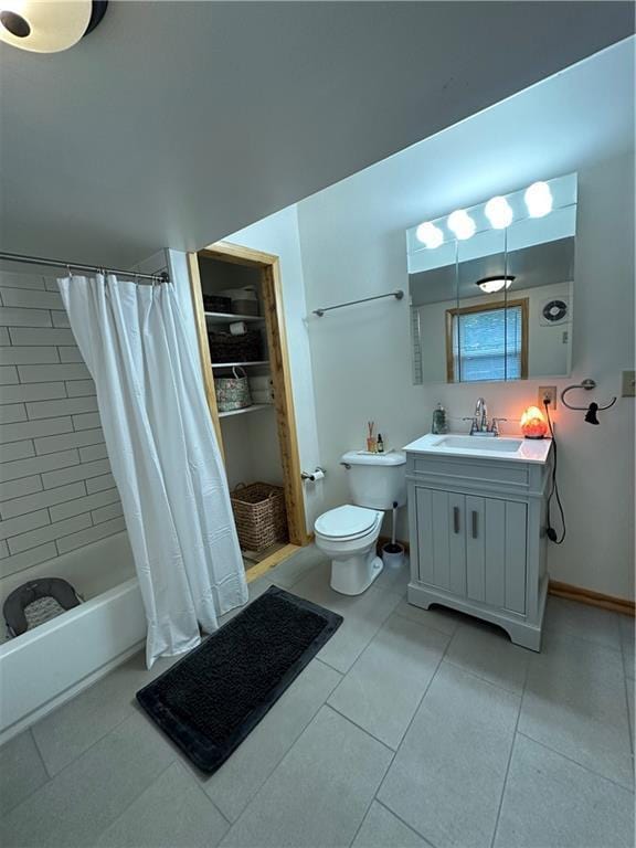 1010 Fillmore St, Black River Falls, WI 54615 - bathroom featuring toilet, tile patterned floors, vanity, and shower / bathtub combination with curtain