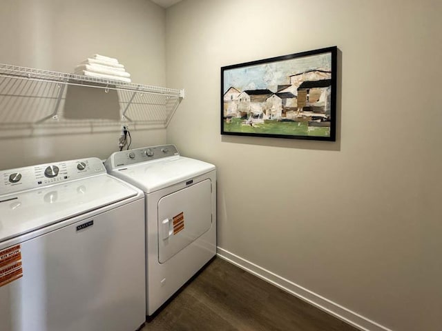 509 Oak Opening Dr, Stoughton, WI 53589 - laundry room with washing machine and clothes dryer, dark wood-type flooring, and baseboards