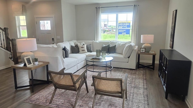 509 Oak Opening Dr, Stoughton, WI 53589 - living area featuring wood finished floors, stairway, and baseboards