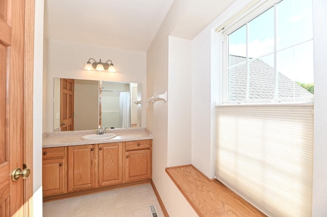 9165 S 47th St, Franklin, WI 53132 - bathroom with vanity, baseboards, and tile patterned floors