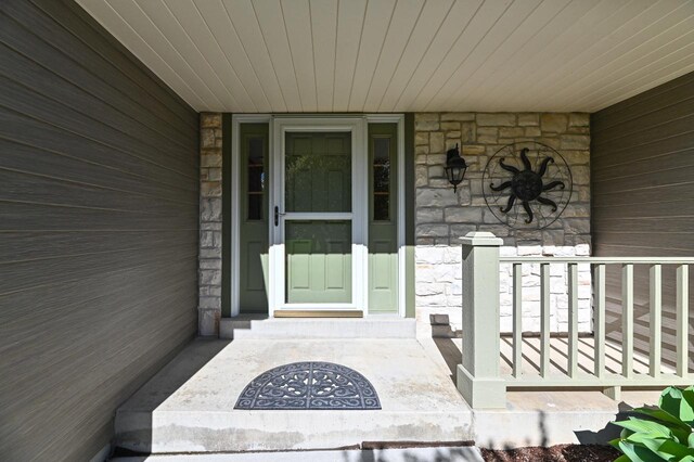 9165 S 47th St, Franklin, WI 53132 - entrance to property featuring stone siding and covered porch