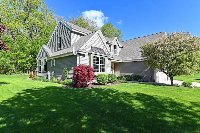 9165 S 47th St, Franklin, WI 53132 - view of side of property featuring an attached garage, a yard, and roof with shingles