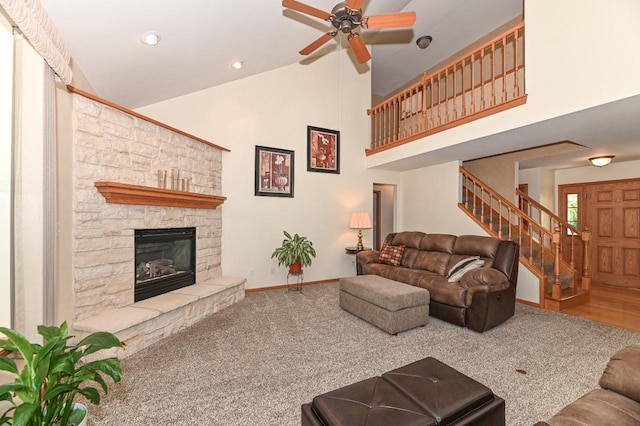 9165 S 47th St, Franklin, WI 53132 - living room with a ceiling fan, stairway, high vaulted ceiling, a stone fireplace, and baseboards