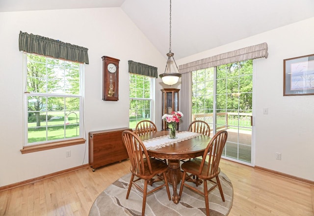 9165 S 47th St, Franklin, WI 53132 - dining area featuring lofted ceiling, light wood-type flooring, and baseboards