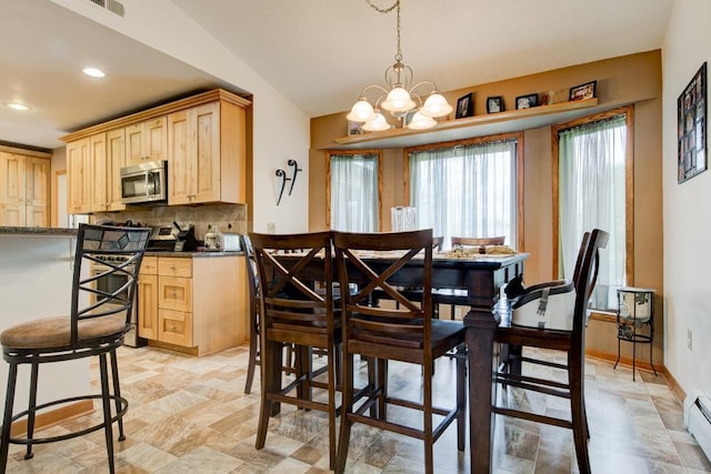 4100 15th St, Menominee, MI 49858 - dining area featuring baseboard heating, stone finish floors, a chandelier, and recessed lighting