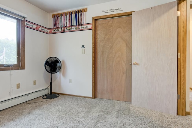 4100 15th St, Menominee, MI 49858 - empty room with carpet, baseboard heating, and baseboards