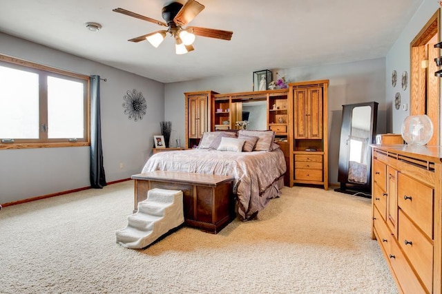 4100 15th St, Menominee, MI 49858 - bedroom featuring light colored carpet, baseboards, and ceiling fan