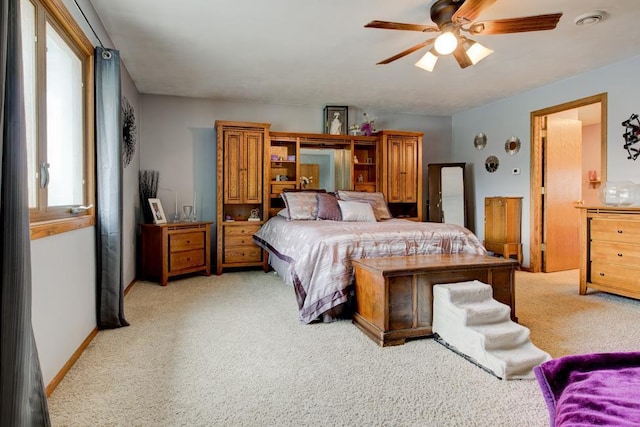 4100 15th St, Menominee, MI 49858 - bedroom with light colored carpet and ceiling fan