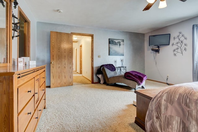 4100 15th St, Menominee, MI 49858 - bedroom with light carpet, a ceiling fan, and baseboards