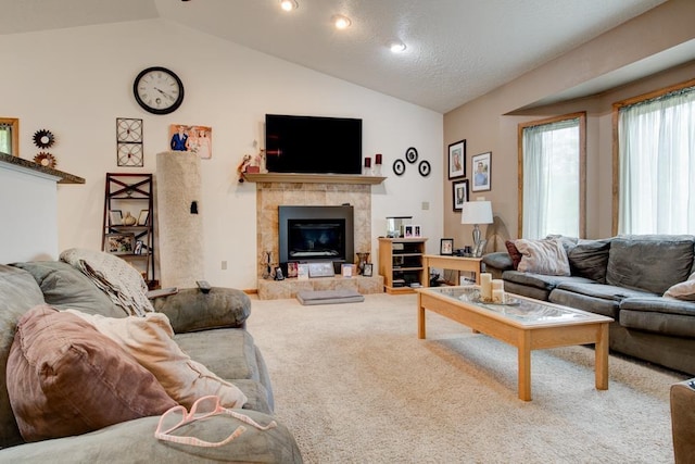4100 15th St, Menominee, MI 49858 - living room featuring vaulted ceiling, carpet, and a tile fireplace