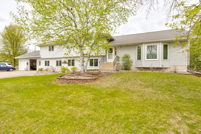4100 15th St, Menominee, MI 49858 - split level home featuring an attached garage, a front yard, and driveway