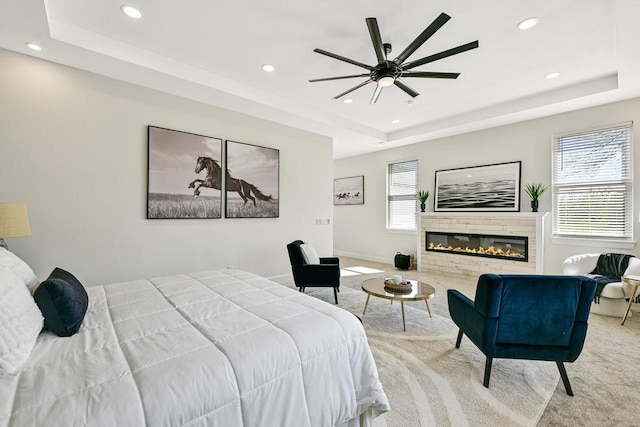 10500 W Vera Ave, Milwaukee, WI 53224 - carpeted bedroom featuring a raised ceiling, recessed lighting, a glass covered fireplace, and a ceiling fan