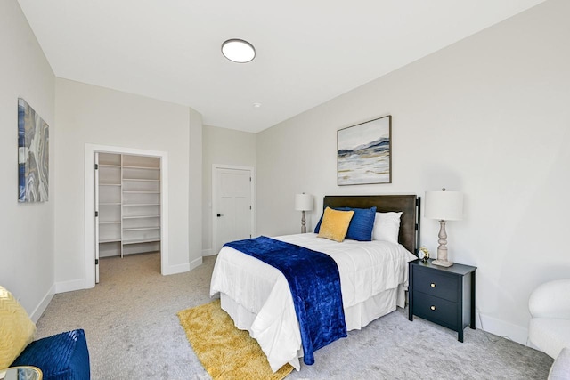 10500 W Vera Ave, Milwaukee, WI 53224 - bedroom with light carpet, baseboards, and a spacious closet