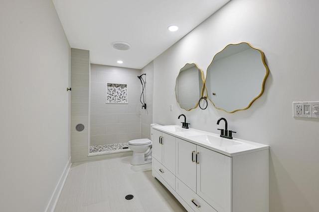 10500 W Vera Ave, Milwaukee, WI 53224 - full bath with double vanity, toilet, a tile shower, recessed lighting, and tile patterned flooring