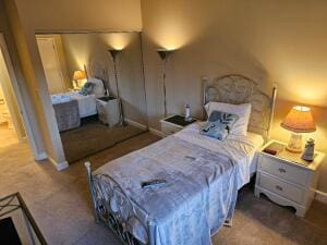 35 Harborview Dr Unit 108, Racine, WI 53403 - bedroom featuring carpet floors, a closet, and baseboards