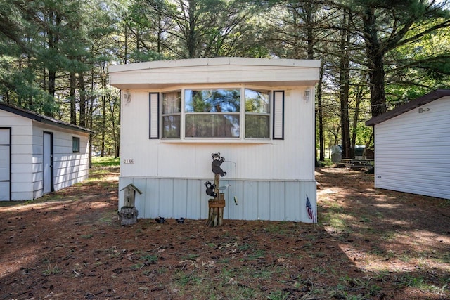 2146 Olmstead St, Friendship, WI 53934 - view of outdoor structure with view of wooded area