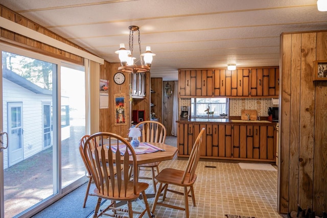 2146 Olmstead St, Friendship, WI 53934 - dining area with wooden walls and a chandelier