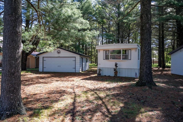 2146 Olmstead St, Friendship, WI 53934 - view of front of home with a detached garage and an outbuilding