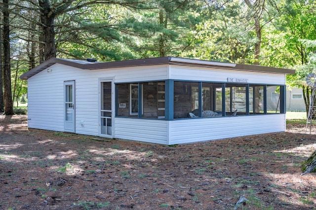 2146 Olmstead St, Friendship, WI 53934 - view of side of property with a sunroom