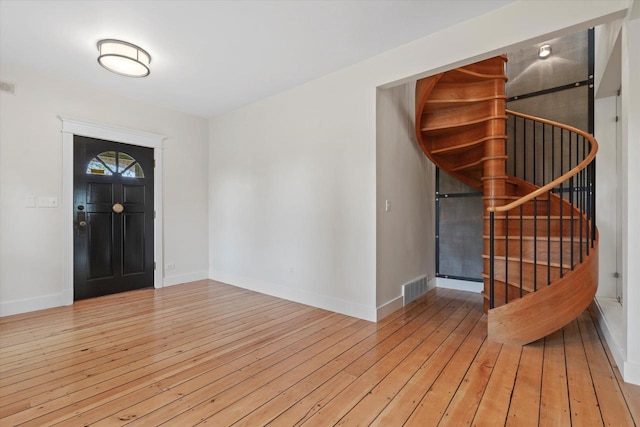 6600 N Ballard Rd, Appleton, WI 54913 - foyer entrance with baseboards, hardwood / wood-style flooring, and stairs