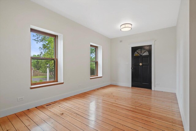 6600 N Ballard Rd, Appleton, WI 54913 - unfurnished room with light wood-style flooring and baseboards