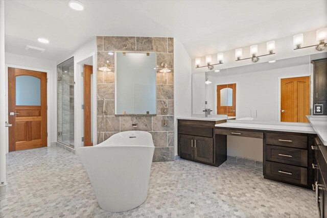 6600 N Ballard Rd, Appleton, WI 54913 - full bathroom with tile walls, vanity, a freestanding bath, and a shower stall