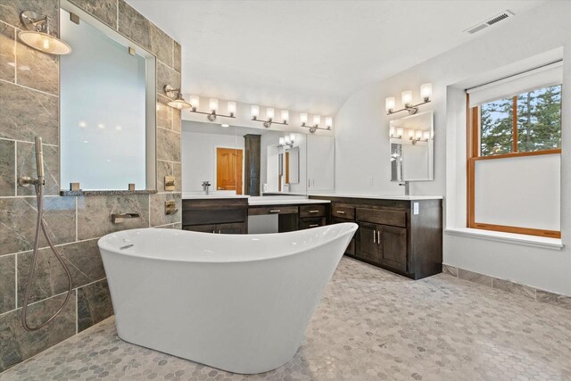 6600 N Ballard Rd, Appleton, WI 54913 - full bath featuring a freestanding tub, vanity, and tile walls