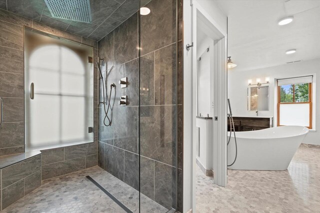 6600 N Ballard Rd, Appleton, WI 54913 - full bath with a tile shower, a freestanding tub, and vanity