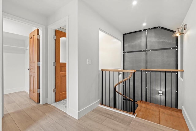 6600 N Ballard Rd, Appleton, WI 54913 - hallway featuring an upstairs landing, wood finished floors, and baseboards