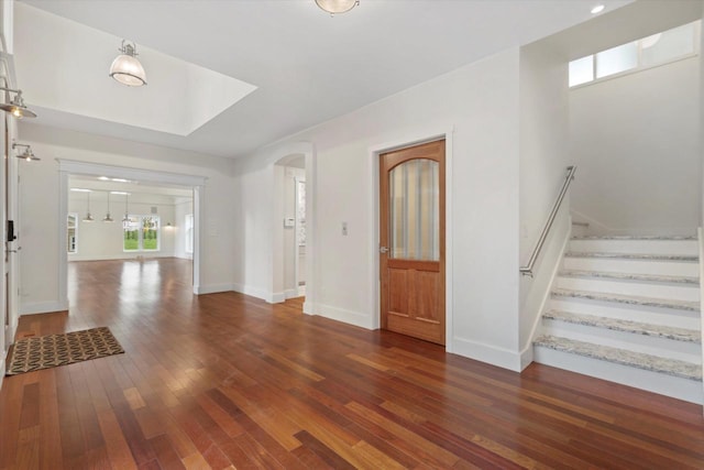 6600 N Ballard Rd, Appleton, WI 54913 - entryway with hardwood / wood-style floors, stairway, baseboards, and arched walkways