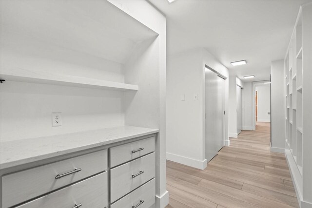 6600 N Ballard Rd, Appleton, WI 54913 - hallway featuring baseboards and light wood-style floors