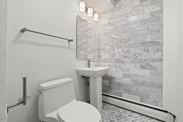6600 N Ballard Rd, Appleton, WI 54913 - bathroom with toilet and baseboard heating