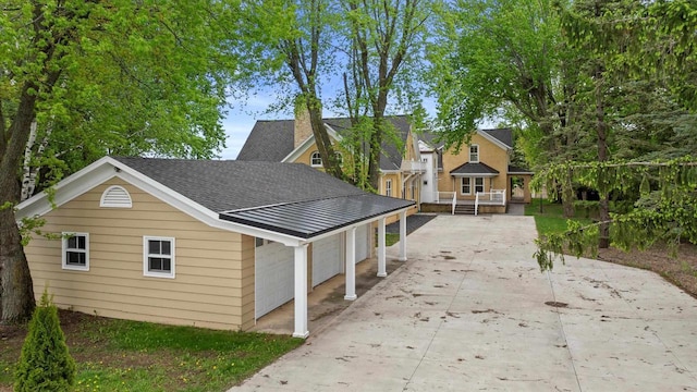 6600 N Ballard Rd, Appleton, WI 54913 - view of front facade with driveway, a garage, a shingled roof, a chimney, and a deck