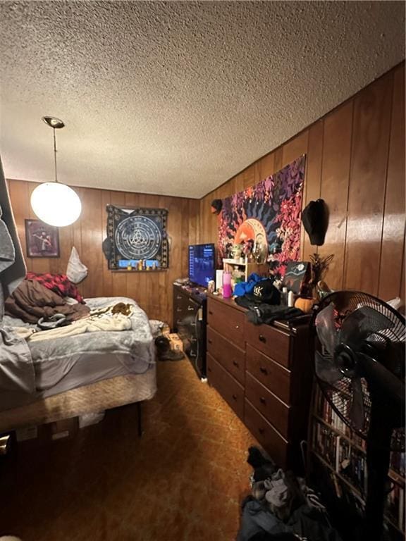 315 Armstrong Ave, Black River Falls, WI 54615 - carpeted bedroom featuring a textured ceiling and wood walls