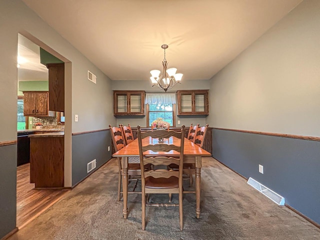 21755 W N Ave, Brookfield, WI 53045 - carpeted dining space with a chandelier and baseboards
