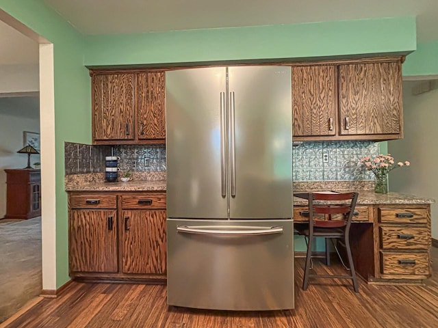 21755 W N Ave, Brookfield, WI 53045 - kitchen with freestanding refrigerator, dark wood finished floors, backsplash, and brown cabinetry