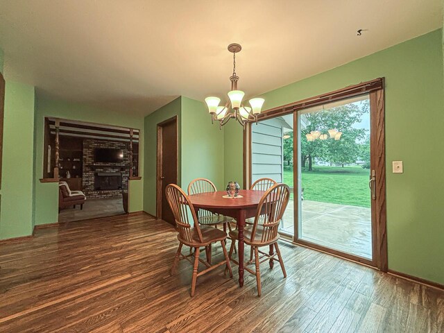 21755 W N Ave, Brookfield, WI 53045 - dining room featuring a chandelier, wood finished floors, and baseboards